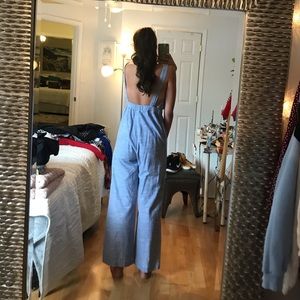 Blue and white jumpsuit with brown buttons